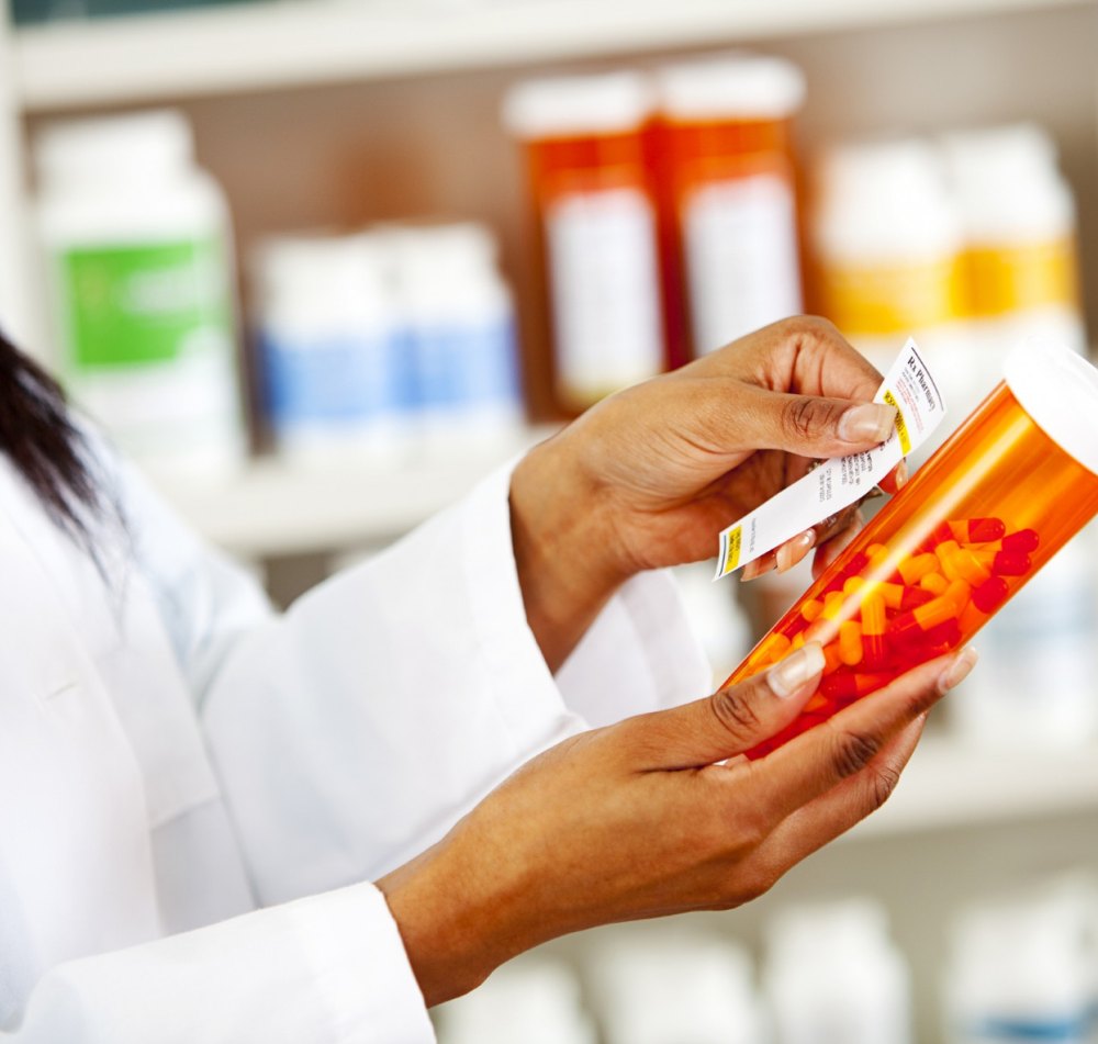 Clinical staff preparing labeled medication for in-office dispensing